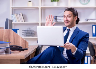 Young handsome businessman working in the office - Powered by Shutterstock