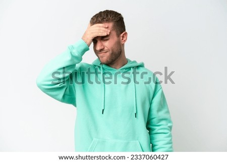 Young handsome caucasian man isolated on white background with headache
