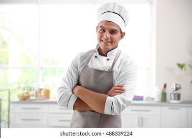 Young Handsome Chef Cook In Kitchen