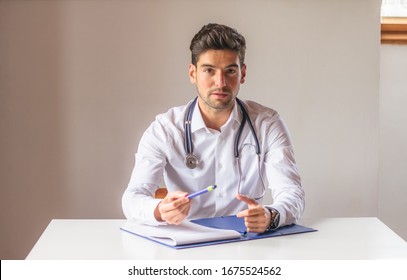 Young Handsome Doctor Speaking In Front Of The Camera.