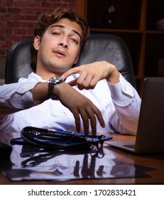 Young Handsome Doctor Working Night Time At The Hospital