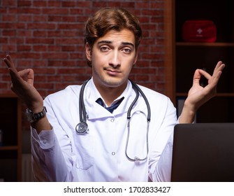 Young Handsome Doctor Working Night Time At The Hospital