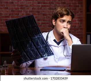 Young Handsome Doctor Working Night Time At The Hospital