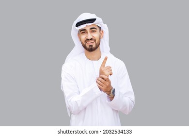 Young Handsome Emirati Business Man In UAE Traditional Outfit Showing A Variety Of Hand Gesture. Arabic Ambitious Mature Businessman.