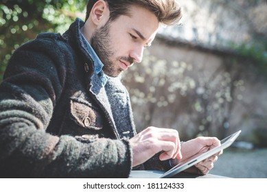 Young Handsome Fashion Model Using Tablet Man Outdoors