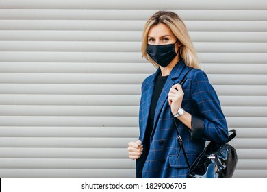 Young Handsome Fashion Woman With Backpack In Face Pollution Mask To Protect Himself From The Coronavirus Walking In City 