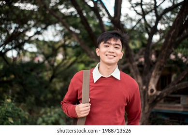 A young handsome Filipino intern, call center agent or BPO employee at the park on route to work. - Shutterstock ID 1988713526