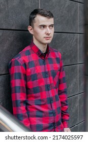 Young Handsome Guy In A Red Checkered Shirt