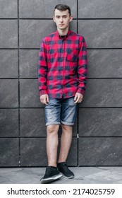 Young Handsome Guy In A Red Checkered Shirt