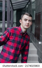 Young Handsome Guy In A Red Checkered Shirt