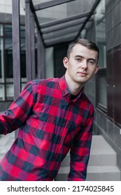 Young Handsome Guy In A Red Checkered Shirt