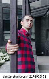 Young Handsome Guy In A Red Checkered Shirt