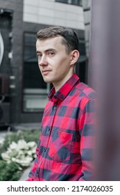 Young Handsome Guy In A Red Checkered Shirt