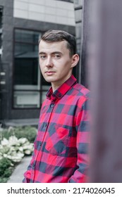 Young Handsome Guy In A Red Checkered Shirt