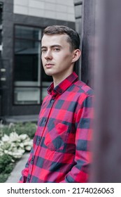 Young Handsome Guy In A Red Checkered Shirt