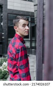 Young Handsome Guy In A Red Checkered Shirt