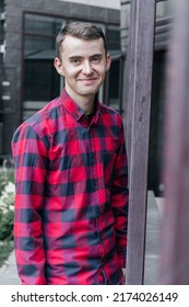 Young Handsome Guy In A Red Checkered Shirt