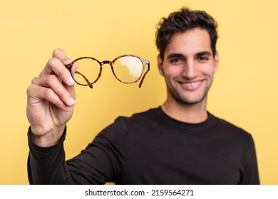 young handsome hispanic man with a glasses