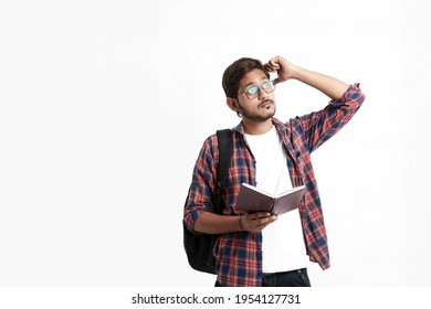 Young Handsome Indian College Student Giving Thinking Expression On White Background