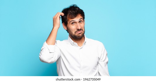 young handsome indian man doubting or uncertain expression - Shutterstock ID 1962735049