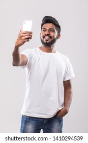 Young Handsome Indian Man Taking Selfie With Mobile Phone