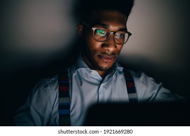 Young Handsome Man Awake At Night Using Computer Remote Working Duing Overtime