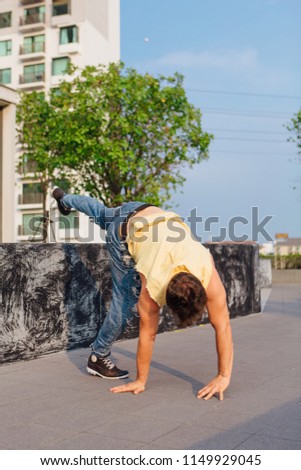 Similar – Athletic man warming up before running.