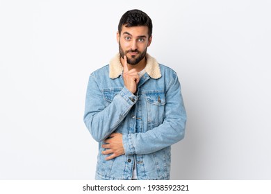 Young Handsome Man With Beard Isolated On White Background And Thinking