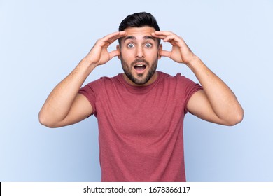 Young Handsome Man With Beard Over Isolated Blue Background With Surprise Expression