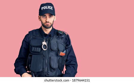 Young Handsome Man With Beard Wearing Police Uniform Depressed And Worry For Distress, Crying Angry And Afraid. Sad Expression. 