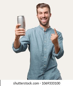 Young Handsome Man, Blue Denim Shirt, Holding A Beer Pint, Dancing Or Celebrating Expression . Person Isolated Against Monochrome Background