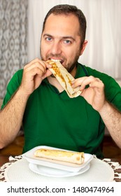 young-handsome-man-eating-doner-260nw-1480474964.jpg