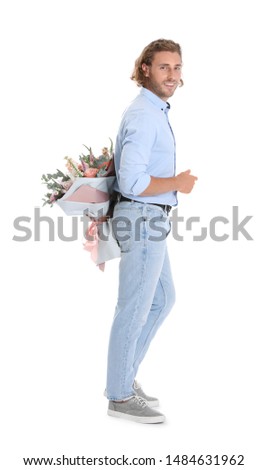 Similar – Man in jeans and plaid shirt with some white flowers in his hand