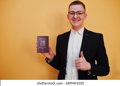 Young handsome man holding Czech Republic passport id over yellow background, happy and show thumb up. Travel to Europe country concept.