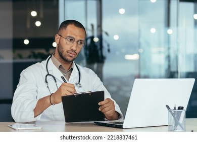 A Young Handsome Man, A Latin American Student, A Trainee Doctor, An Intern Studies Via Video Link From A Laptop. He Sits Serious In The Office, Passes The Exam, Writes Down.