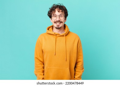 Young Handsome Man Looking Happy And Pleasantly Surprised