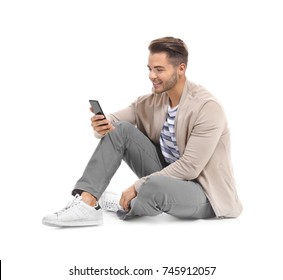 Young Handsome Man With Mobile Phone Against White Background