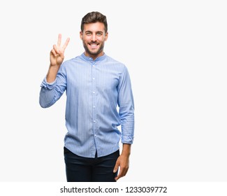 Young handsome man over isolated background showing and pointing up with fingers number two while smiling confident and happy.