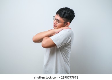 Young Handsome Man Over Isolated White Background Hugging Oneself Happy And Positive, Smiling Confident. Self Love And Self Care