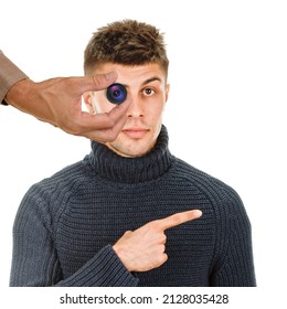 Young Handsome Man Pointing With Finger To The Side , Hidden Spy Camera In The Foreground