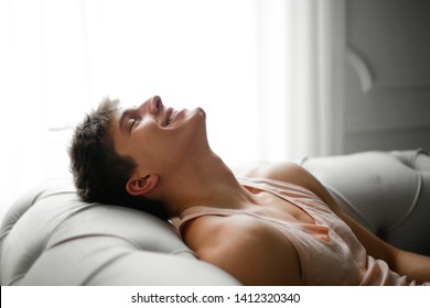 Young handsome man relaxing at home. - Shutterstock ID 1412320340