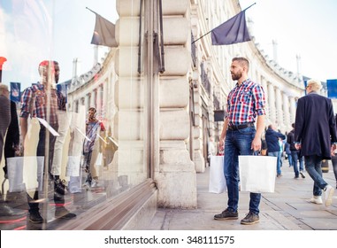 Young Handsome Man Shopping In The Streets Of London