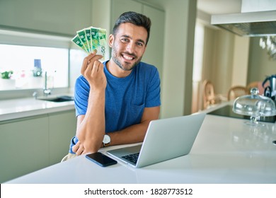 Young Handsome Man Smiling Happy Holding Israeli Shekels Banknotes At Home