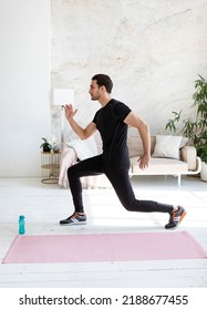 Young Handsome Man In Sportswear Do Exercises At Home. Healthy Lifestyle And Self Isolation Concept