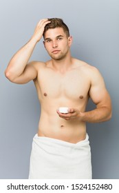 Young Handsome Man Using Hair Wax