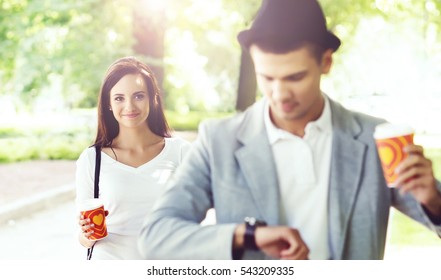 Young Handsome Man Waiting For His Girlfriend In The Park. Love, Relationship, Dating: Concept