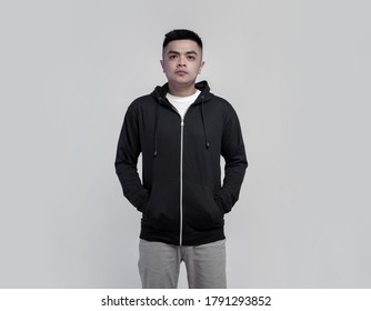 Young Handsome Man Wearing Black Zip Hoodie Isolated On Background Suitable For Mockup