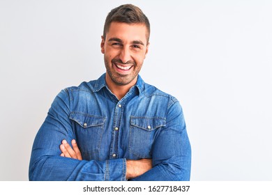 Young handsome man wearing denim jacket standing over isolated background happy face smiling with crossed arms looking at the camera. Positive person. - Shutterstock ID 1627718437