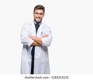 Young handsome man wearing doctor, scientis coat over isolated background happy face smiling with crossed arms looking at the camera. Positive person.