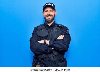 Young Handsome Man Wearing Police Uniform Happy Face Smiling With Crossed Arms Looking At The Camera. Positive Person. 